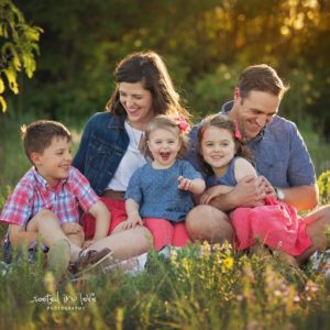 Family portrait in a field of flowers.